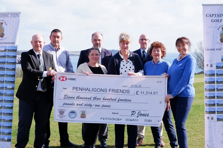 Representatives from Falmouth Golf Club present a cheque for £11,314 to Penhaligon’s Friends representatives. 